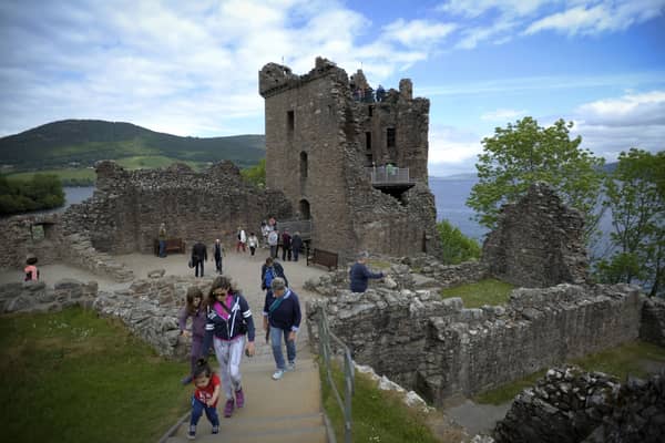 Tourists at Urquhart Castle on the banks of Loch Ness. PIC: Getty/Andy Buchanan.