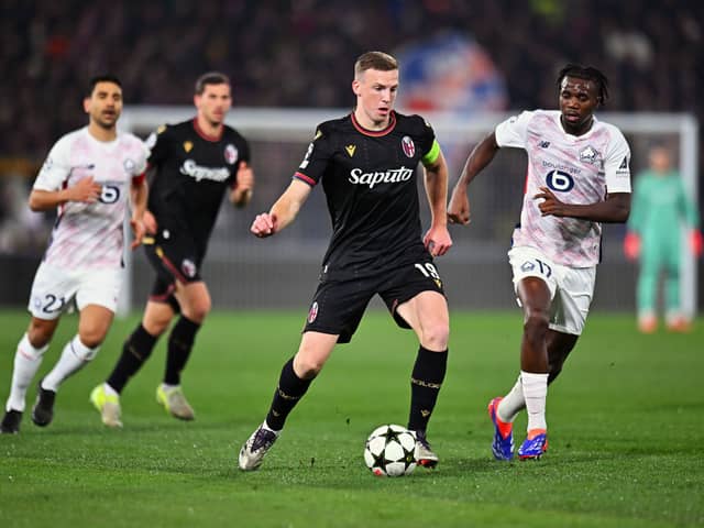 Lewis Ferguson of Bologna controls the ball under pressure from Ngal'ayel Mukau of LOSC Lille. Cr. Getty Images.