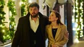 Tom Burke as Cormoran Strike and Holliday Grainger as Robin Ellacott.
