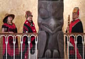 Delegates from the Nisga'a nation beside the 11-metre tall memorial pole during a visit to the National Museum of Scotland in Edinburgh, ahead of its return to what is now British Columbia, August 2023