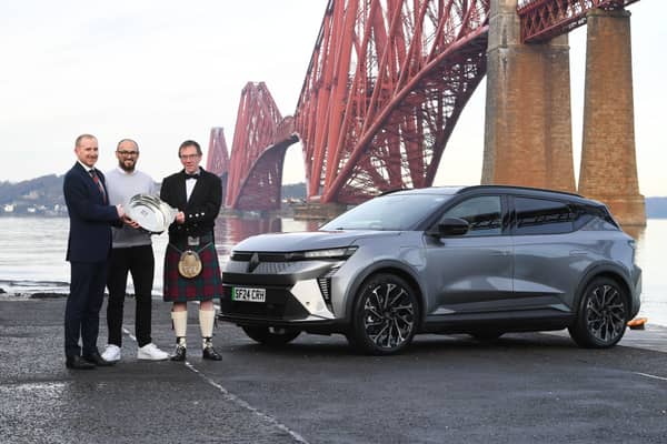 Andrew Currie, Renault Franchise Manager, Arnold Clark, Aidan Chesters, Scenic Product Manager, Renault UK, and Alisdair Suttie, President ASMW celebrating the win by the Forth Bridge with the Renault E-Scenic