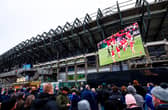 Fans watch the Wales v Fiji on the big screen outside the stadium before Scotland v South Africa. John McGuigan wants supporters to 'come earlier and leave later'.