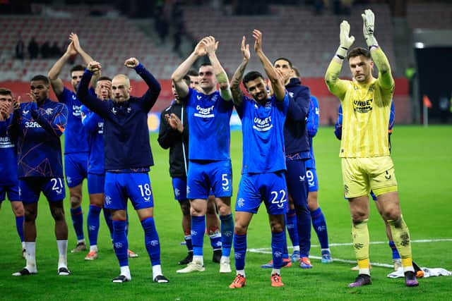 The Rangers players celebrate their win over Nice with the travelling fans.