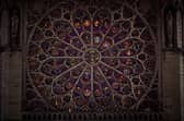 The South Rose window of Notre-Dame de Paris cathedral illuminated just a few days before the cathedral's reopening. Picture: Kiran Ridley/AFP via Getty Images