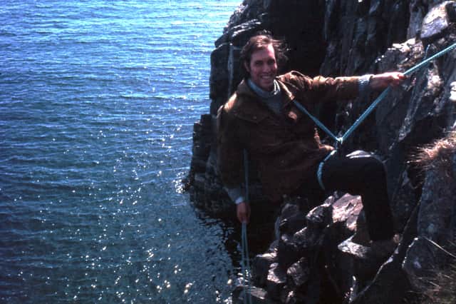 Anderson Burr Bakewell abseiling at Geodha Isligea on the island in the 1960s. He went on to buy a house there and became the owner of the entire island in 1995. PIC: Anderson Burr Bakewell.