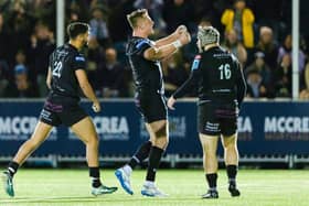 Glasgow Warriors' Ben Afshar, Stafford McDowall and Grant Stewart celebrate.