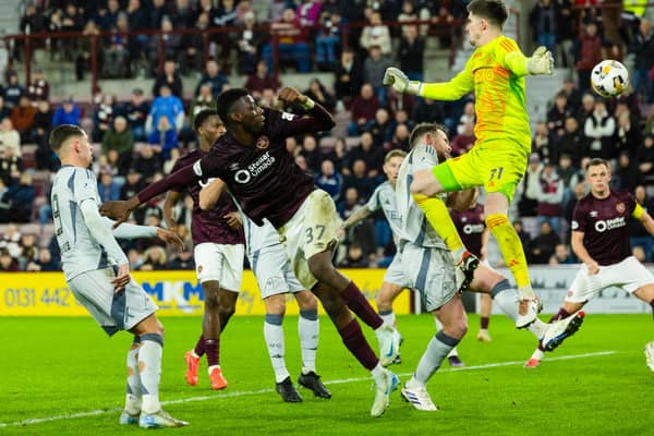 Hearts fought back to earn a point against Aberdeen.
