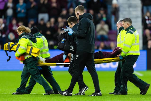 Hearts defender Stephen Kingsley left the pitch on a stretcher.