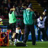 Glasgow Warriors' Adam Hastings goes off injured following a tackle from Scarlets' Vaea Fifita during a BKT United Rugby Championship match at Scotstoun Stadium, on November 29, 2024, in Glasgow, Scotland. (Photo by Craig Williamson / SNS Group)