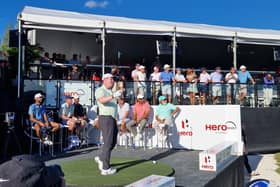 Bob MacIntyre is watched by Tiger Woods as he takes part in the Hero Shot at Albany Golf Course in the Bahamas