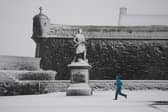 A person runs in the snow at Stirling Castle during Storm Bert late last month. Picture: PA