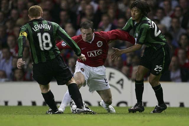 Wayne Rooney and Neil Lennon battle for the ball during their playing days. Cr: Getty Images.