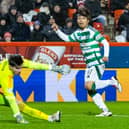 Celtic's Reo Hatate scores to seal a 1-0 win over Aberdeen at Pittodrie Stadium. (Photo by Ross MacDonald / SNS Group)