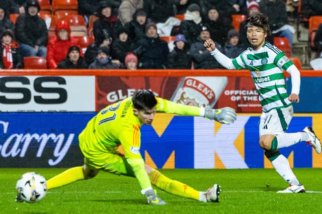 Celtic's Reo Hatate scores to seal a 1-0 win over Aberdeen at Pittodrie Stadium. (Photo by Ross MacDonald / SNS Group)