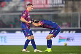 Riccardo Orsolini celebrates Bologna's second goal with Lewis Ferguson. Cr: Getty Images.