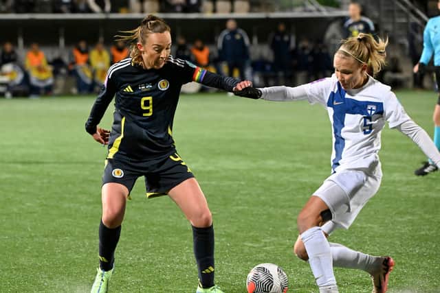 Caroline Weir (L) vies with Emma Koivisto of Finland as Scotland crash out of Women’s Euro 2025 qualifying in Helsinki. Cr: AP.