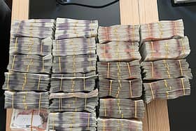 Photo issued by National Crime Agency of bundles of cash seized