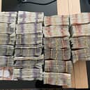 Photo issued by National Crime Agency of bundles of cash seized