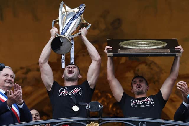 Blair Kinghorn lifts the Champions Cup last season.