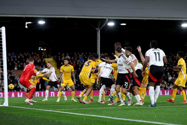 Brighton's Matt O'Riley (No 33) deflects in an own goal.