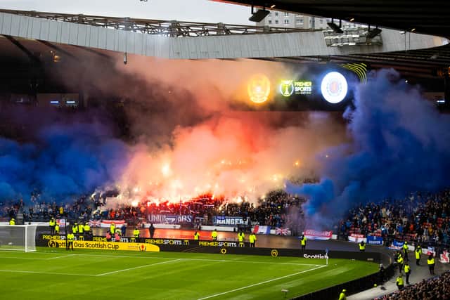 Rangers fans let off pyrotechnics which caused a delay to kick-off due to poor visibility ahead of the Premier Sports Cup semi-final against Motherwell at Hampden Park. (Photo by Craig Williamson / SNS Group)