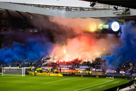 Rangers fans let off pyrotechnics which caused a delay to kick-off due to poor visibility ahead of the Premier Sports Cup semi-final against Motherwell at Hampden Park. (Photo by Craig Williamson / SNS Group)