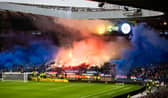 Rangers fans let off pyrotechnics which caused a delay to kick-off due to poor visibility ahead of the Premier Sports Cup semi-final against Motherwell at Hampden Park. (Photo by Craig Williamson / SNS Group)