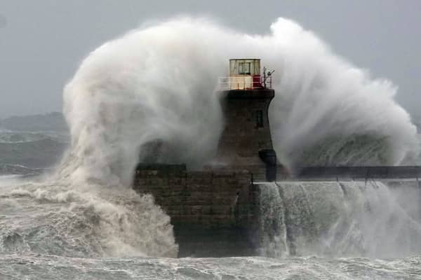 Waves crashing against South Shields lighthouse in England. Very dangerous winds are set to hit the UK's west coast from as early as Friday night. Picture: PA