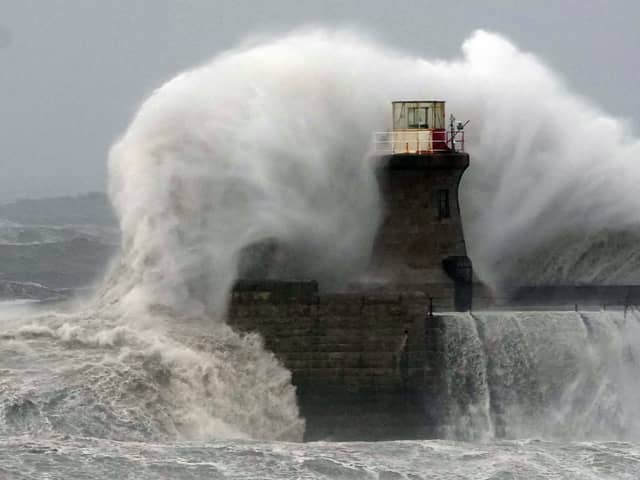 Waves crashing against South Shields lighthouse in England. Very dangerous winds are set to hit the UK's west coast from as early as Friday night. Picture: PA