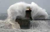 Waves crashing against South Shields lighthouse in England. Very dangerous winds are set to hit the UK's west coast from as early as Friday night. Picture: PA