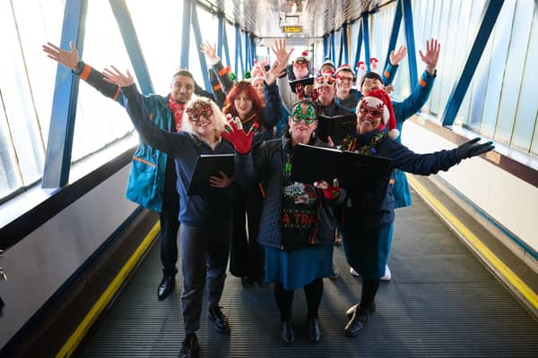 Carol singers take over Uk train station to spread important message