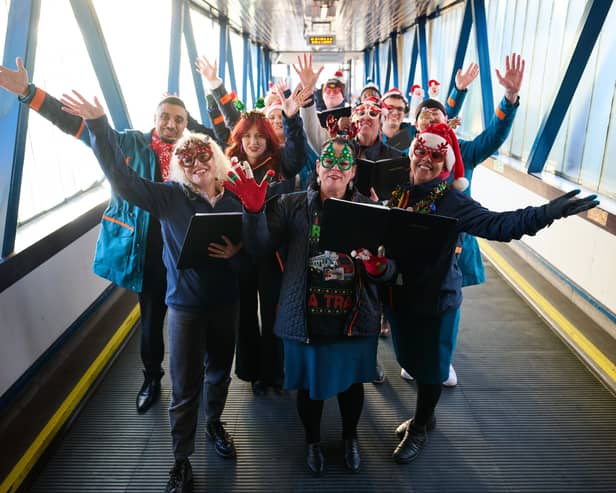 Carol singers take over Uk train station to spread important message