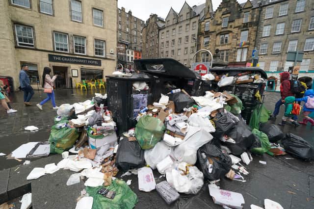 Occasional bin strikes provide a visual reminder of just how much work councils do to keep the country going (Picture: Andrew Milligan)