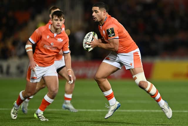 Mosese Tuipulotu of Edinburgh tries to drive forward.