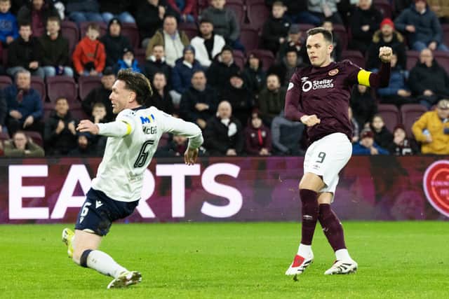 Lawrence Shankland scores his second goal of the game as Hearts prevailed 2-0 over Dundee.