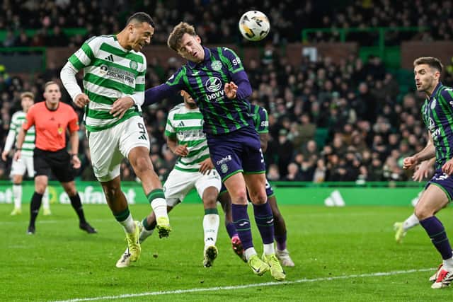 Celtic's Adam Idah glances a header towards goal.