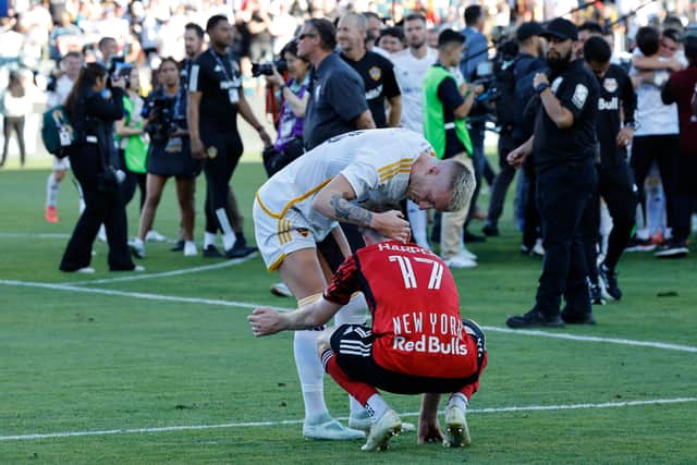 Marco Reus of Los Angeles Galaxy consoles Cameron Harper of New York Red Bulls after the 2024 MLS Cup Final. (Photo by Kevork Djansezian/Getty Images)