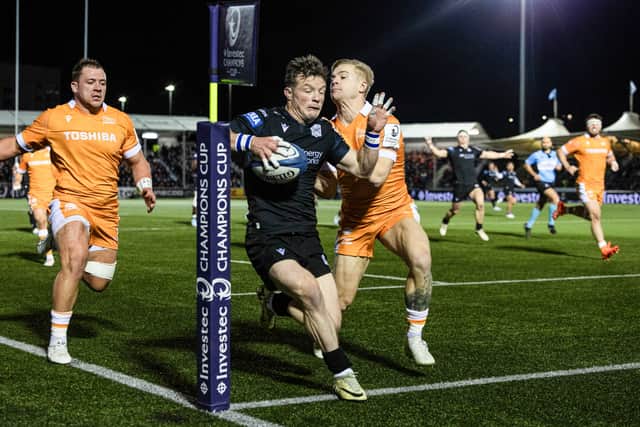 George Horne evades Arron Reed's tackle to score the second try for Glasgow against Sale.