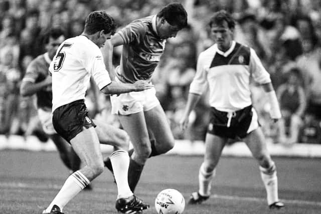 Rangers winger Ted McMinn tackled by Dundee's Jim Smith (left) in a Skol Cup quarter-final in September 1986.