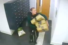 This is the moment a bold thief walks into a luxury apartment block and steals residents Amazon parcels.  