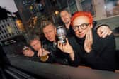Travis with their new beer, Raze the Bar