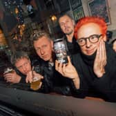 Travis with their new beer, Raze the Bar
