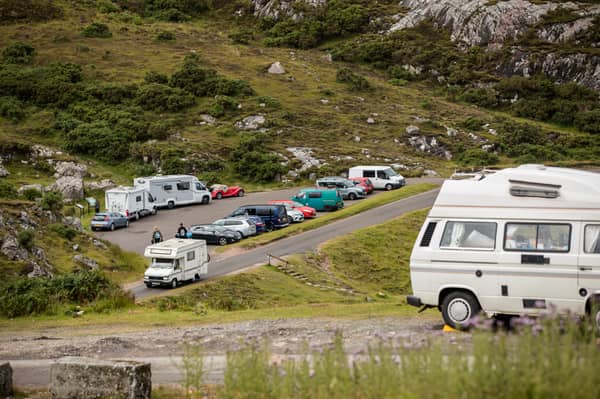 Campers and cars on the NC500 near Ullapool, one of the areas which could benefit from a £4m fund to protect communities and infrastructure from pressures caused by high visitor numbers. Picture taken in July 2020. 