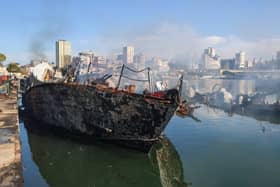 Smoke billows from a Syrian naval ship destroyed in an overnight Israeli attack on the port city of Latakia