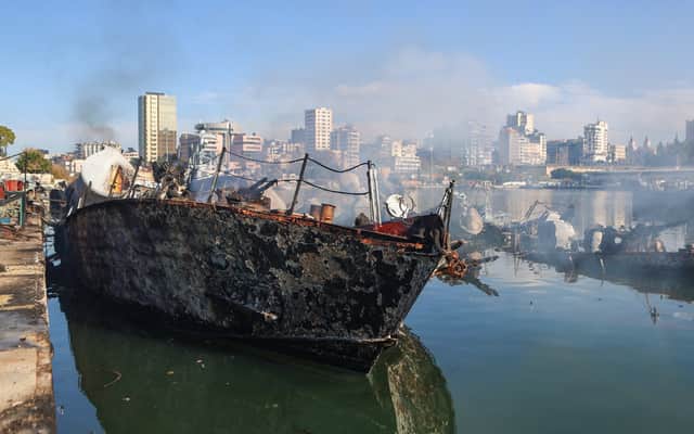 Smoke billows from a Syrian naval ship destroyed in an overnight Israeli attack on the port city of Latakia