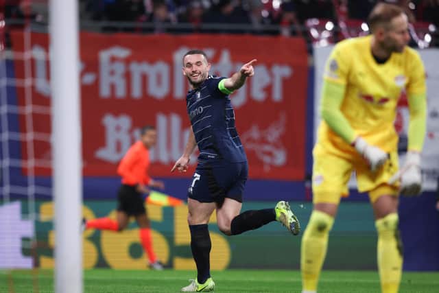 Aston Villa's Scottish midfielder John McGinn celebrates his opening goal in the 3-2 win over RB Leipzig in the Champions League. (Photo by RONNY HARTMANN/AFP via Getty Images)