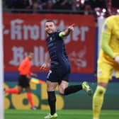 Aston Villa's Scottish midfielder John McGinn celebrates his opening goal in the 3-2 win over RB Leipzig in the Champions League. (Photo by RONNY HARTMANN/AFP via Getty Images)