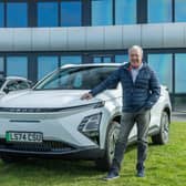 Scotsman contributor Jim McGill poses with the Omoda E5