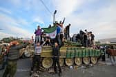 People celebrate in Umayyad Square, Damascus, after the fall of the Assad regime (Picture: Louai Beshara)