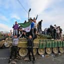 People celebrate in Umayyad Square, Damascus, after the fall of the Assad regime (Picture: Louai Beshara)